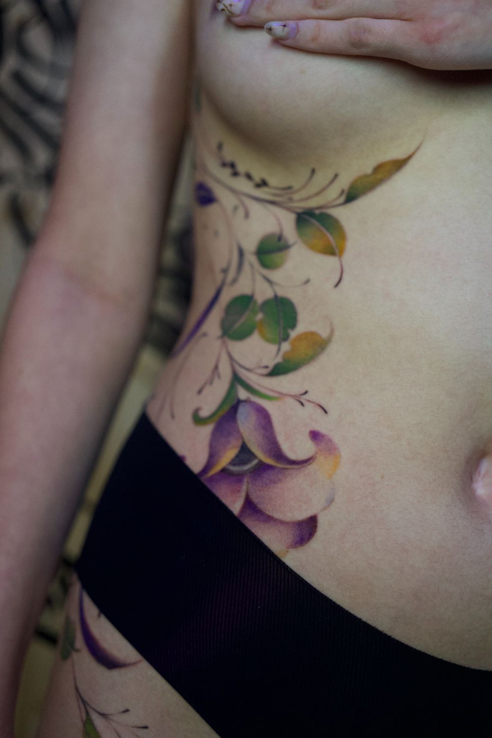 delicate ornamental floral rib tattoo by Antwan Rodriguez, West Palm Beach FL