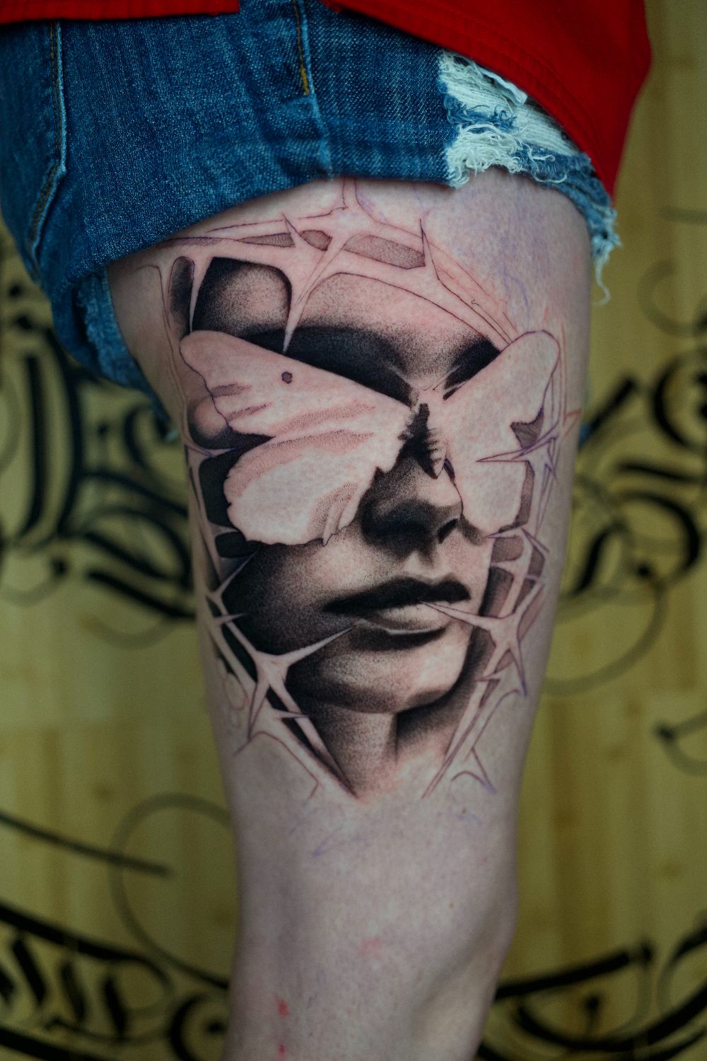 black and gray surreal fragmented portrait thigh tattoo by Antwan Rodriguez, West Palm Beach FL